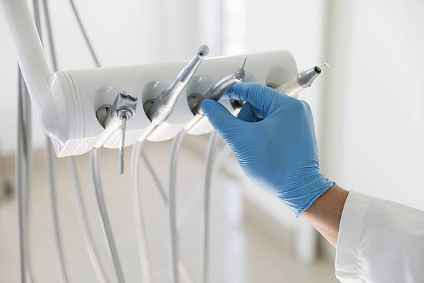 Professional Tooth Extraction technician working in Creve Coeur, IL